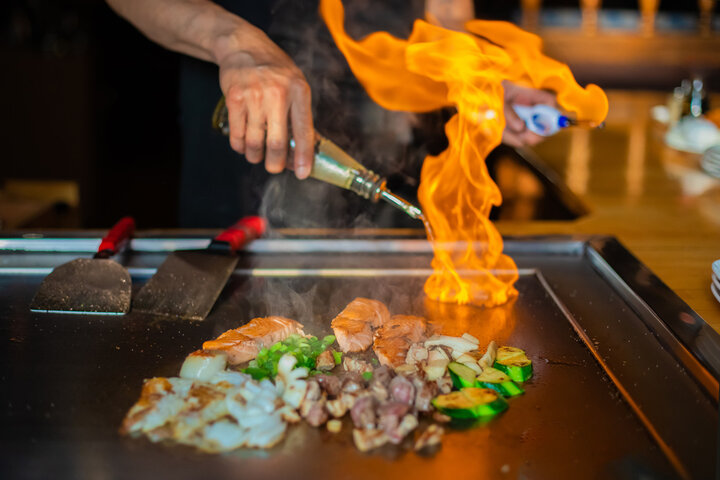 Hibachi chef performing live fire show at private event